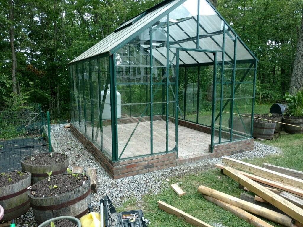 Greenhouse put on it's new foundation after a tornado left the greenhouse unscathed. 