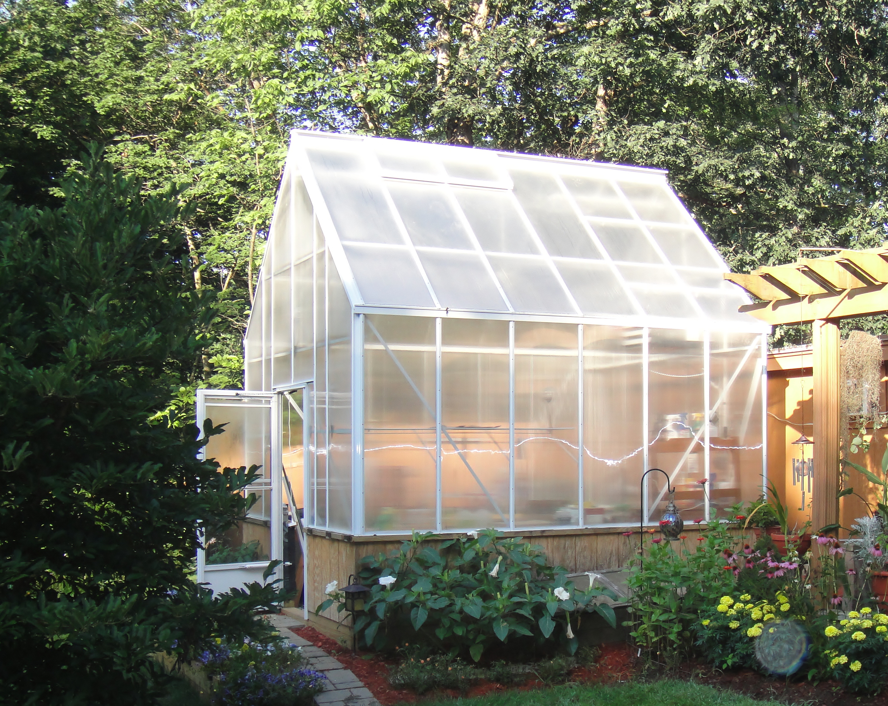 white cape cod greenhouse with twinwall polycarbonate